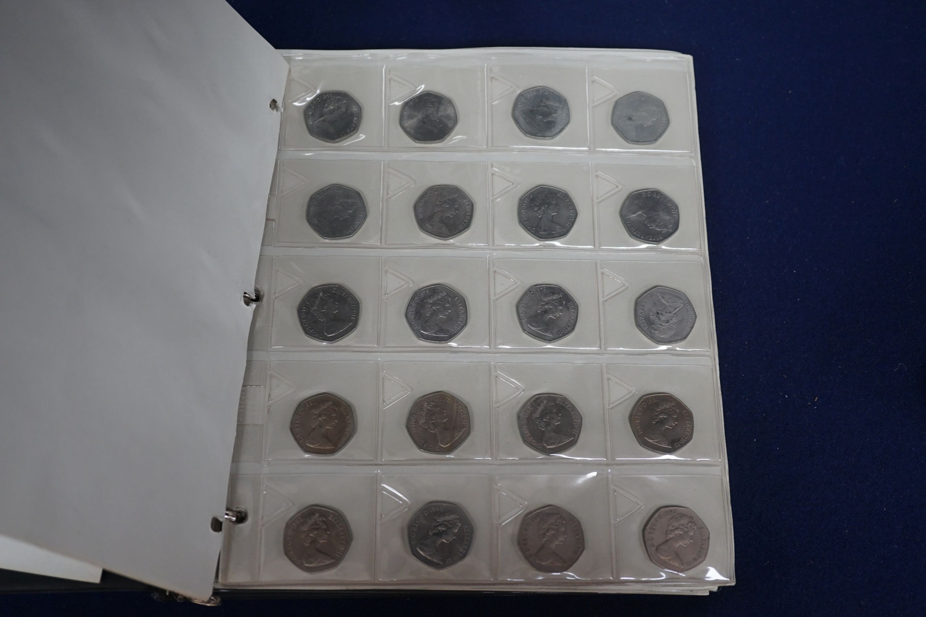 An album of British crowns, halfcrowns, florins and decimal 50 pence and 20 pence coins, including 1819 crown F, etc. and various loose UK coins and banknotes in envelopes